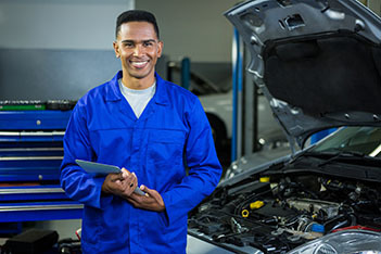 Auto Maintenance Mechanic preparing for a client at Ace Garage